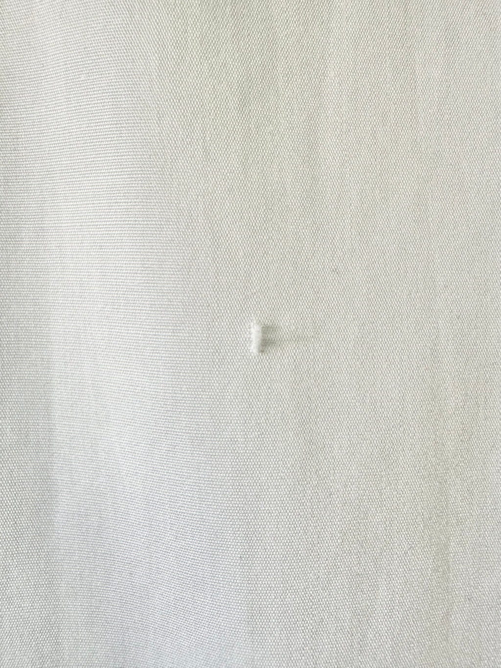 Close-up of a textured white fabric surface