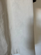 Close-up of a textured beige trench coat