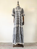 Floral dress on a mannequin against a white wall