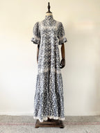 Floral dress on a mannequin against a white wall