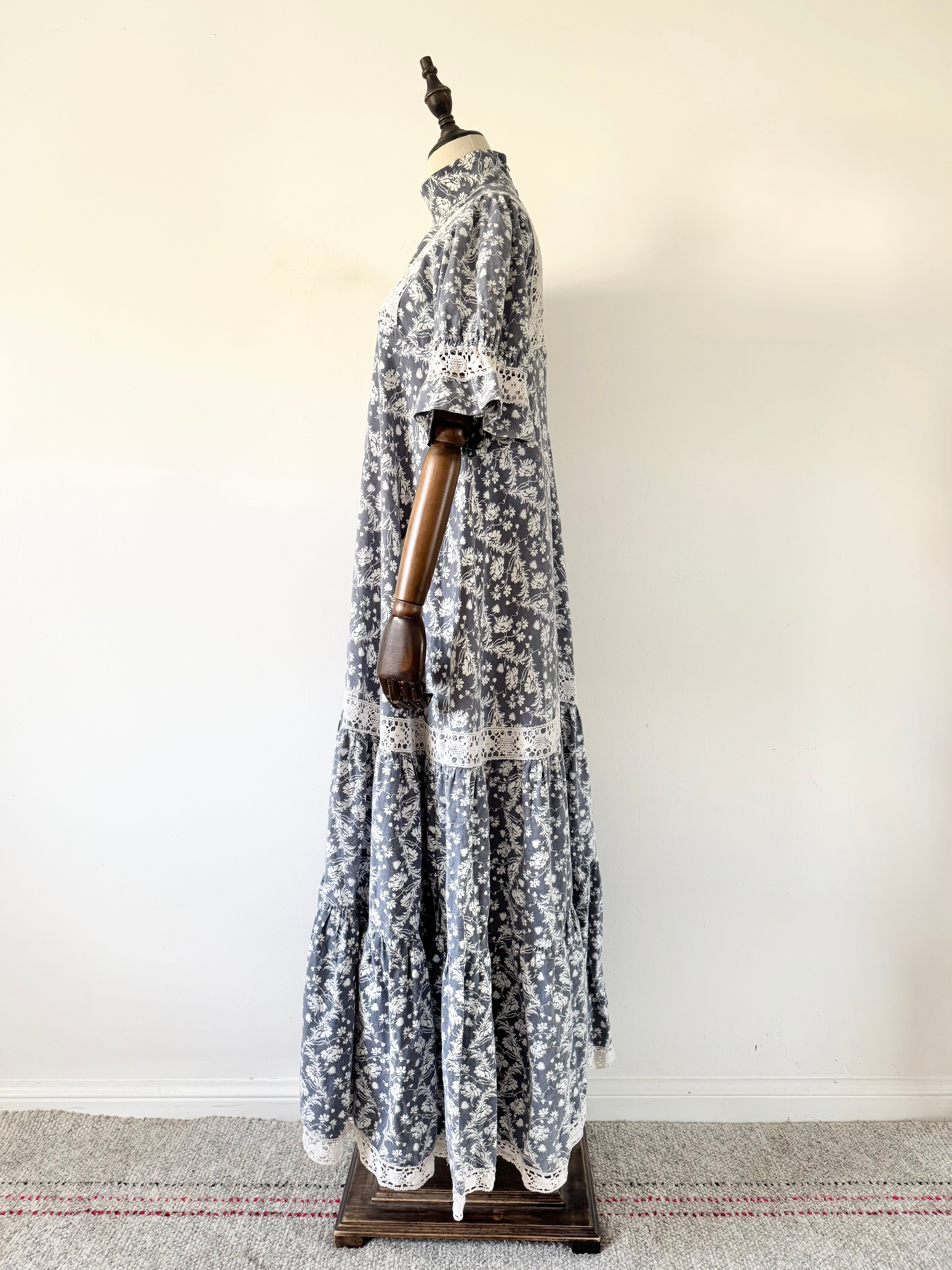 Long floral dress on a mannequin against a white background