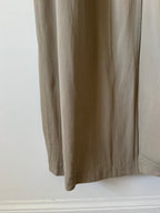 Close-up of beige trench on a white background