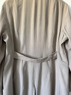 Close-up of beige trench coat back