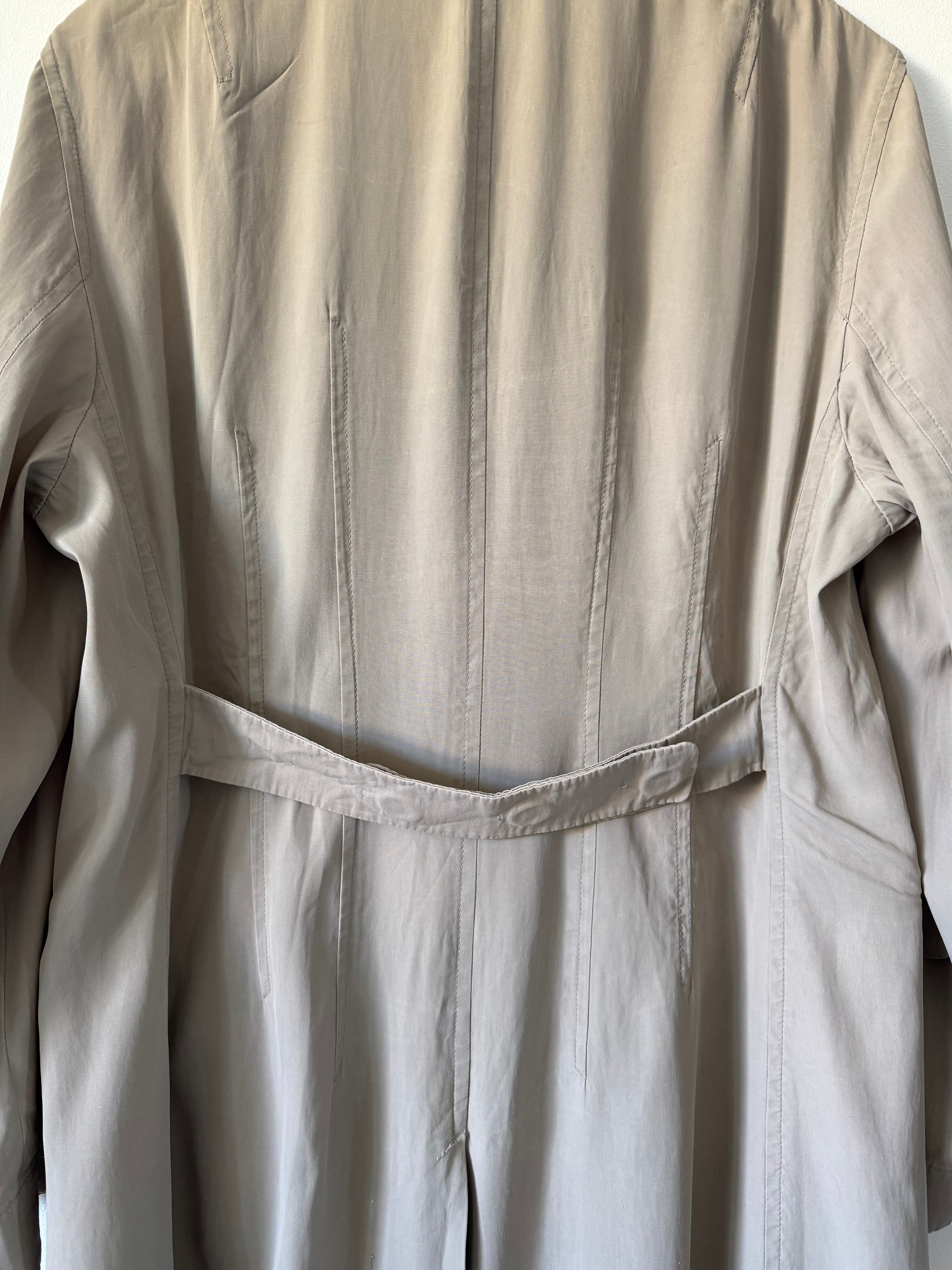 Close-up of beige trench coat back