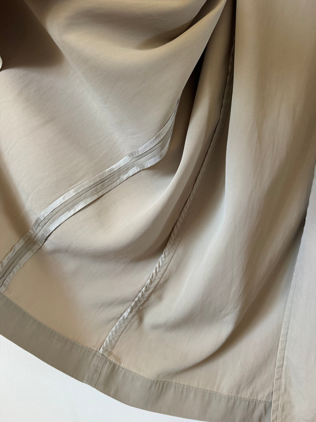 Close-up of inside trench coat.